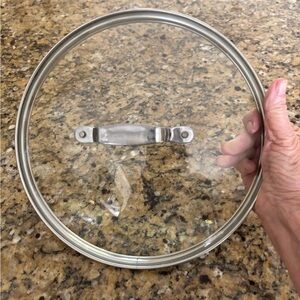 GLASS LID GOOD CONDITION 11” CIRCUMFERENCE OUTER/ INNER STAINLESS RIM 10”